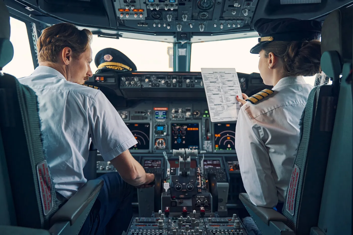 Pilot-and-first-officer-seated-in-the-flight-deck